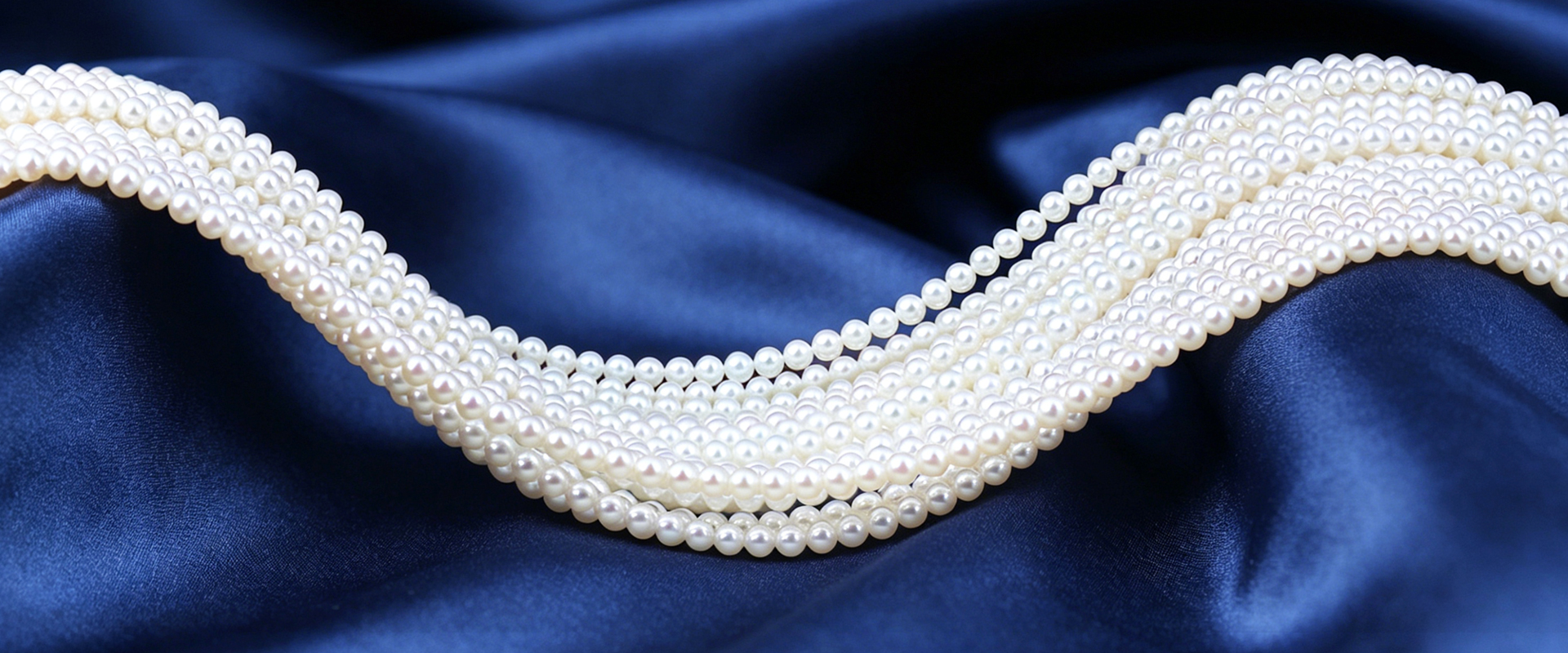 freshwater pearls strands on blue silk for wholesale pearl jewelry